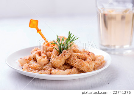 Fried squid rings with lemon, herbs and spices Fried squid rings with lemon, herbs and spices 22741276