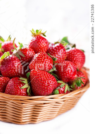 Fresh strawberry harvest in the basket, on white Fresh strawberry harvest in the basket, on white 22741386