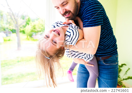 Close up of hipster father holding his little 22741601