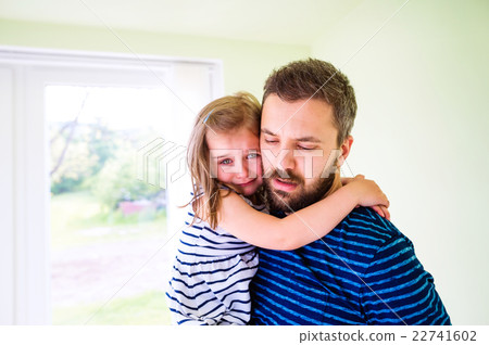 Close up of hipster father holding his crying 22741602