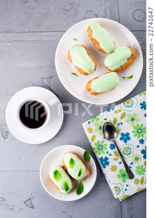 Breakfast with mint eclairs and coffee. Top view 22741647