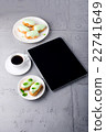 Mint eclairs on a plate, coffee and digital tablet 22741649