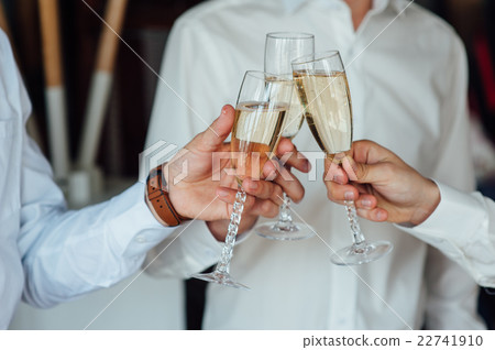 three Successful businessman toasting Champagne three Successful businessman toasting Champagne 22741910