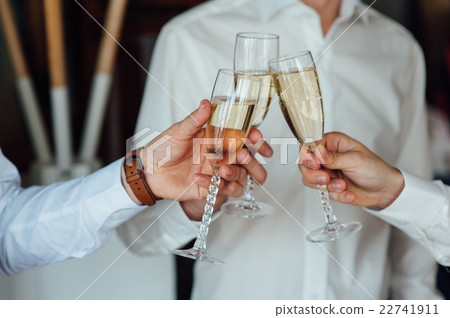 three Successful businessman toasting Champagne three Successful businessman toasting Champagne 22741911