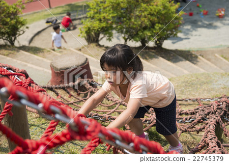 A girl playing at a park athletic 22745379