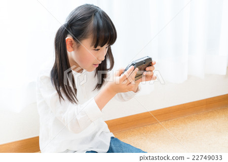 Children focused on games Children focused on games 22749033