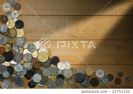 Old Coins on Wooden Background 22752130