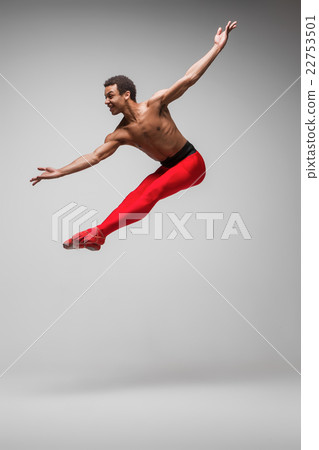 Young and stylish modern ballet dancer on gray 22753501