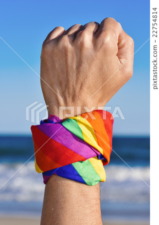 man with a rainbow-patterned kerchief in his wrist man with a rainbow-patterned kerchief in his wrist 22754814