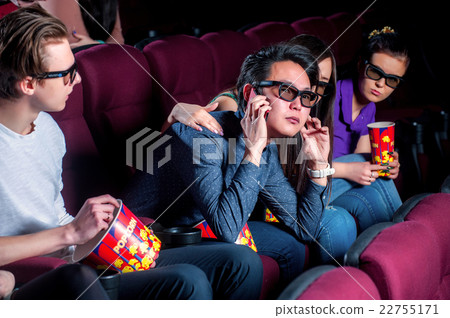 People in the cinema wearing 3d glasses People in the cinema wearing 3d glasses 22755171