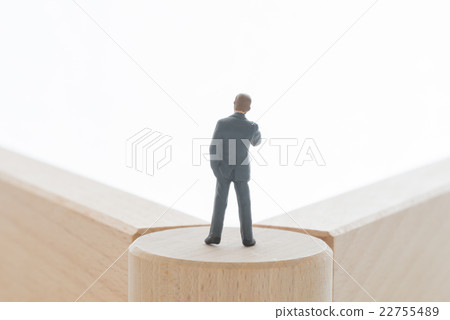 A businessman standing at a turning point A businessman standing at a turning point 22755489