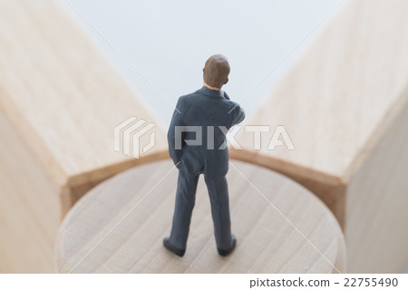 A businessman standing at a turning point 22755490