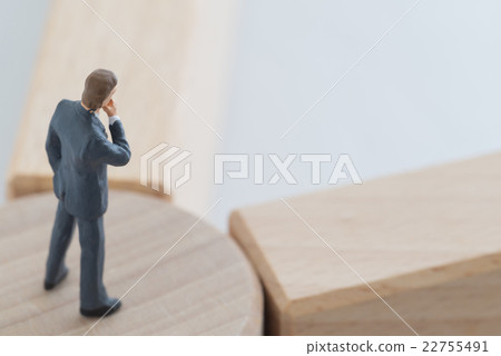 A businessman standing at a turning point A businessman standing at a turning point 22755491