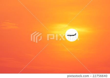 airplane on the beautiful sun and red sky. 22756640