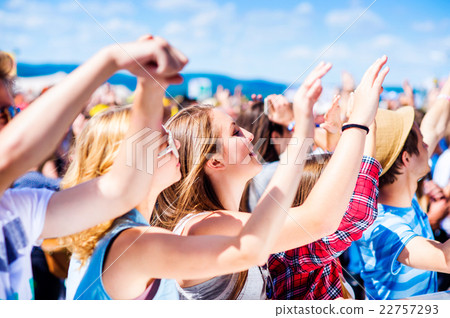 Teenagers at summer music festival having good Teenagers at summer music festival having good 22757293