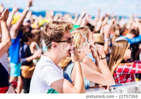 Teenagers at summer music festival having good 22757308