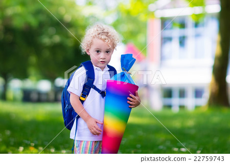 Little child with candy cone on first school day Little child with candy cone on first school day 22759743