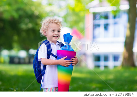 Little child with candy cone on first school day Little child with candy cone on first school day 22759894