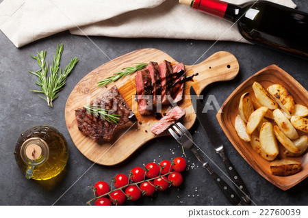 Grilled striploin steak and red wine Grilled striploin steak and red wine 22760039