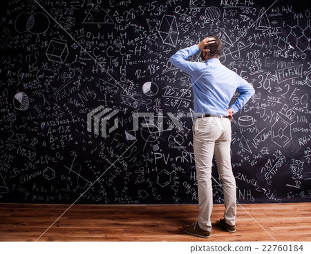 Hipster teacher against big blackboard with Hipster teacher against big blackboard with 22760184