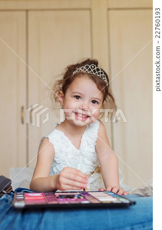 Little girl with princess crown playing with make Little girl with princess crown playing with make 22760193