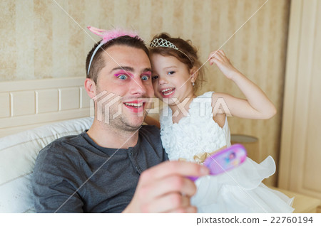 Cute girl that put on make up on her father Cute girl that put on make up on her father 22760194