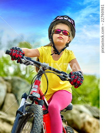 Bikes cycling girl wearing helmet rides bicycle. 22760981