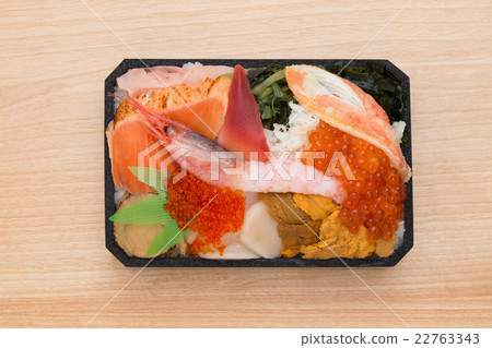 Bowl of rice topped with sashimi  22763343