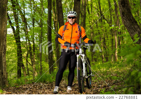 Cyclist Riding the Bike on a Trail in Summer 22768881