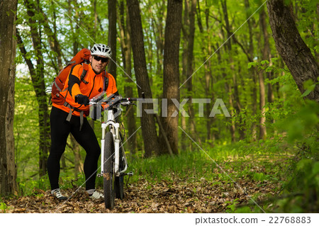 Cyclist Riding the Bike on a Trail in Summer 22768883