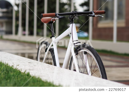 white fixed-gear bicycle on street white fixed-gear bicycle on street 22769017