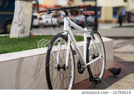 white fixed-gear bicycle on street white fixed-gear bicycle on street 22769019