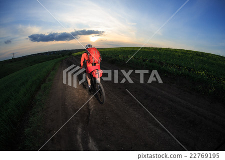 Young man is riding bicycle outside. Healthy Young man is riding bicycle outside. Healthy 22769195