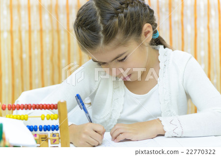 Schoolgirl at her Desk 22770322