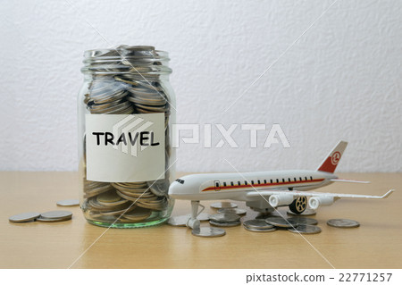 Money saving for travel in the glass bottle 22771257