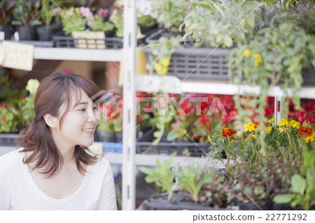 A woman shopping at a gardening store 22771292