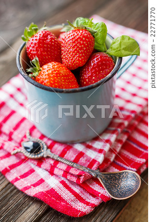 Fresh juicy strawberries  in old rusty mug.  22771770