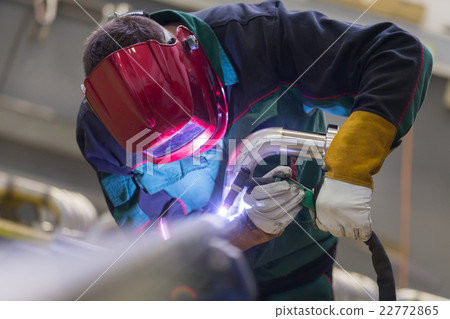 Industrial worker welding in metal factory. 22772865