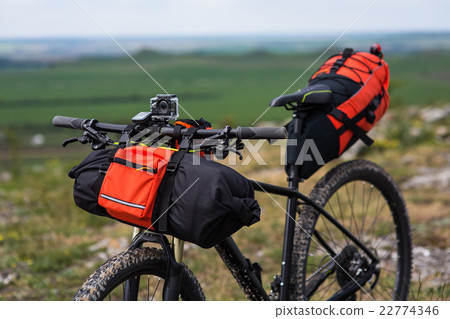 Bicycle with orange bags for travel 22774346