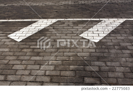 White traffic marks on pavement. 22775083