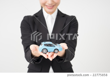 A woman holding a car A woman holding a car 22775858