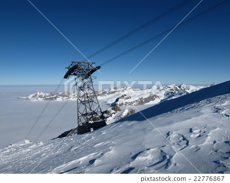 Pylon of a cable car, sea of fog and mountains 22776867
