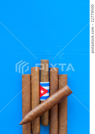 Detail of luxury Cuban cigars on the blue table 22779500