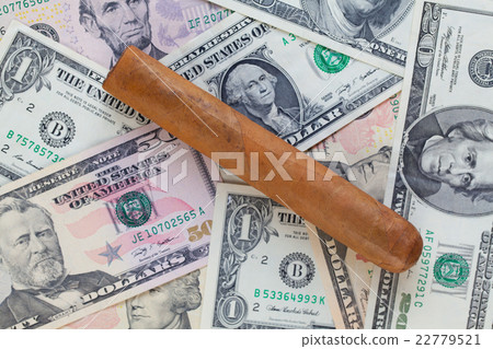 Detail of luxury Cuban cigar on the US dollars 22779521