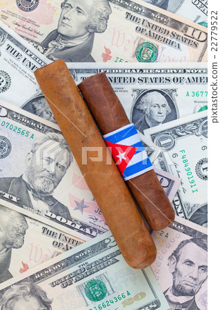 Detail of luxury Cuban cigars on the US dollars 22779522
