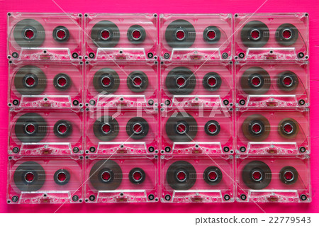 Set of old audio cassettes on wooden table. 22779543