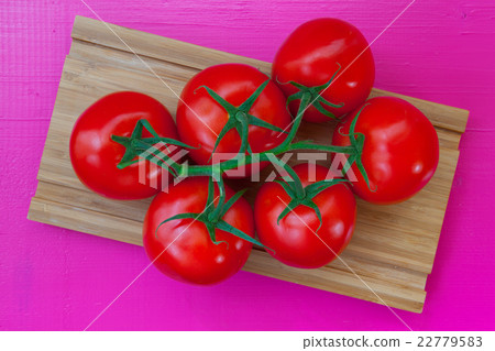 Red tomatoes on the wooden table Red tomatoes on the wooden table 22779583