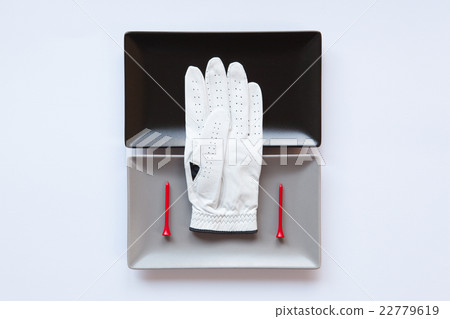 Different ceramic dishes with golf equipments Different ceramic dishes with golf equipments 22779619