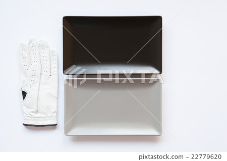 Different ceramic dishes with golf glove Different ceramic dishes with golf glove 22779620
