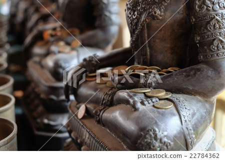 Angel statue with put the coins by donors 22784362